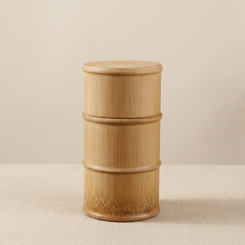 Wooden cylindrical container on a beige background